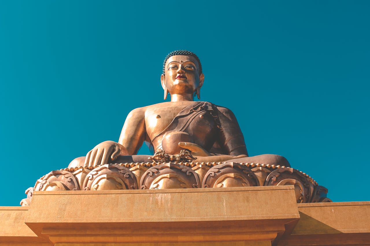 Stunning view of the Buddha Dordenma statue under a clear blue sky in Bhutan.