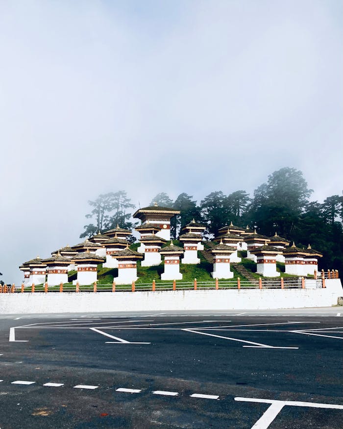 Scenic view of the 108 Druk Wangyal Chortens at Dochula Pass shrouded in mist.